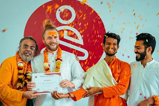 Ole Netek, student of Nirvana Yoga School receiving his 500 hour Yoga Teacher Training certification	